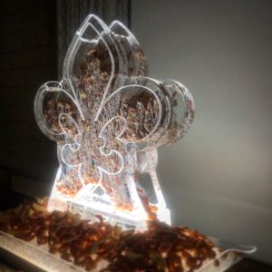 a fleur de lis ice sculpture is full of chilled shrimp at the NOPSI hotel in New Orleans