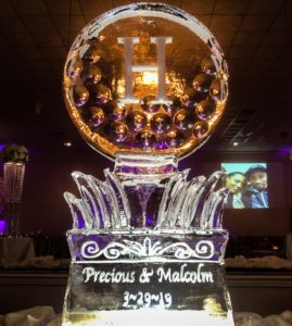 golf ball wedding ice sculpture with H monogram and the couples names and wedding date at Champagne Palace