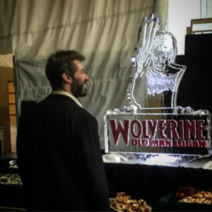 Hugh Jackman checks out an ice portrait of his Logan character