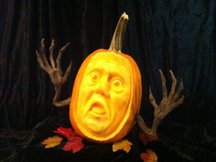 sculpted pumpkin with a horrified expression