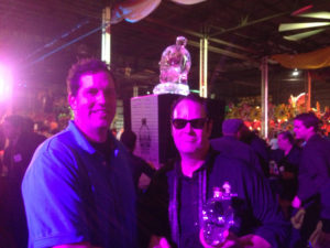 Dawson List and Dan Aykroyd with a Crystal Head Vodka ice sculpture in the background