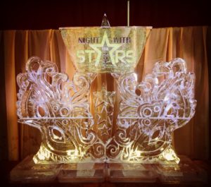 double Mardi Gras mask logo ice sculpture with "A Night with the Stars 2017"