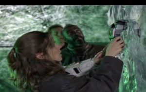 the cast of Earth 2 examine a giant ice block