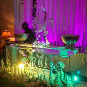 a fleur de lis ice luge sits atop a monogrammed ice bar at the Omni Royal Orleans in the French Quarter