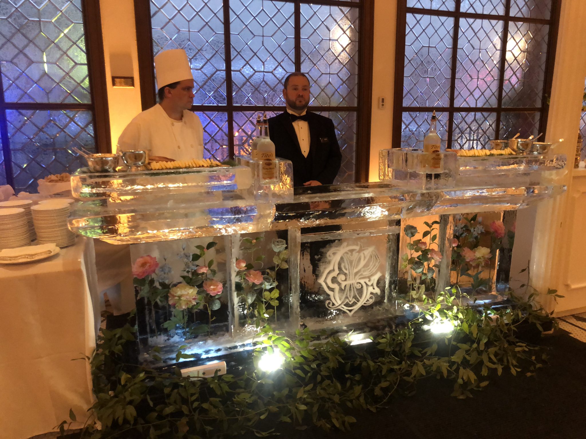 flowers are frozen into this combination food and liquor service ice bar for a wedding at Arnaud's in the French Quarter