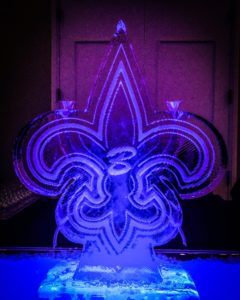 a customized Saints fleur de lis ice luge for a wedding
