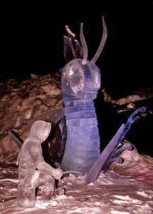 an ice sculpture of a lake monster attacking an ice fisherman. At Lake Louise, Banff, Alberta, Canada and by Dawson List and Scott Nagel