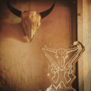 Magnificent 7 steer head and guns ice sculpture and and an actual steer head skull