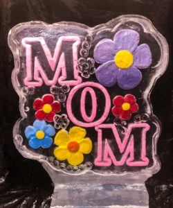 colored flowers and lettered 'MOM' ice sculpture for a Mother's Day brunch