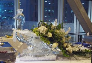 peacock ice sculpture with floral tail