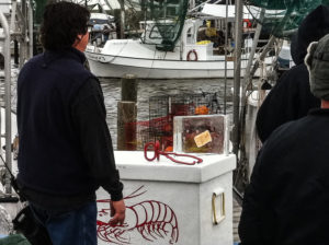 a frozen fish patty ice block and some ice tongs, on set for a Popeye's commercial