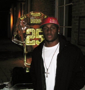 Reggie Bush stands by his New Orleans Saints jersey ice sculpture