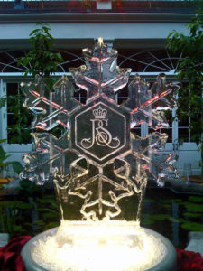 snowflake ice sculpture with the Royal Sonesta logo engraved in the center