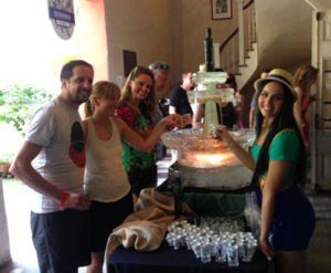 A crowd stands around a working ice fountain for Becherovka during a Tales of the Cocktail event in the French Quarter