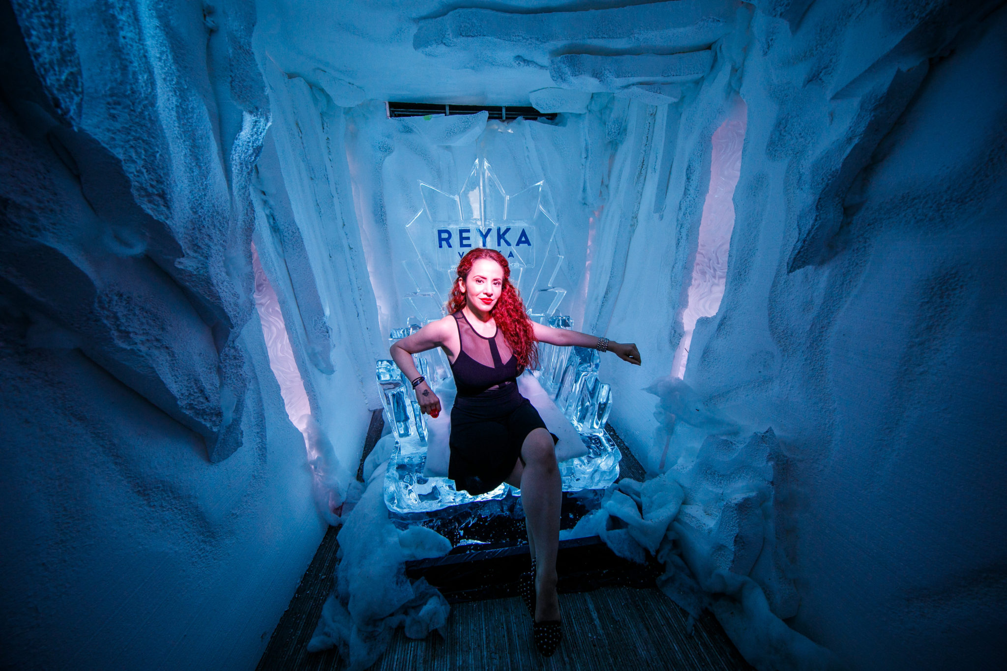 a model sits in a Reyka Vodka ice throne during the 2017 Tales of the Cocktail in New Orleans