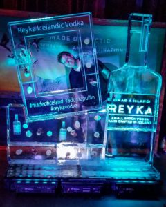 Dawson List peeks into the Reyka Vodka ice photo wall at the Fillmore New Orleans during the 2019 Tales of the Cocktail