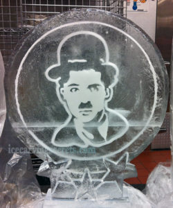ice portrait of Charlie Chaplin, sitting in a freezer
