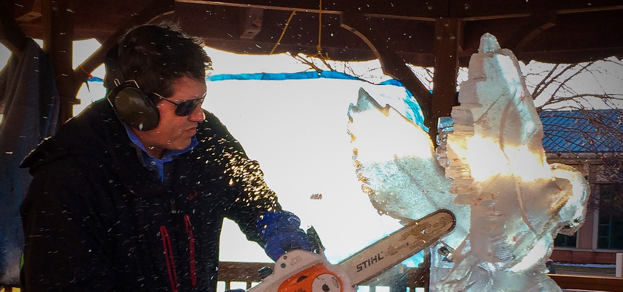 ice sculptor Dawson List works on an eagle sculpture at an ice sculpting competition in Iowa