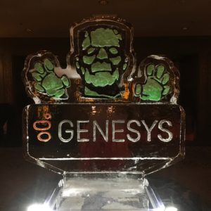 color engraved ice sculpture depicting Frankenstein's monster reaches out about a Genesys logo