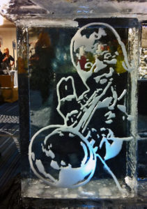 engraved ice carving of Louis Armstrong that's part of a larger ice bar