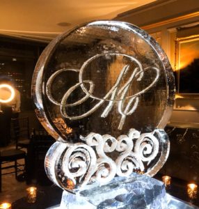 Engraved gold 'M' initial ice sculpture at the Windsor Court Hotel