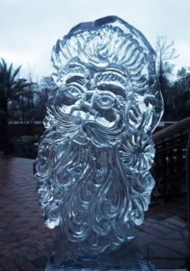 ice sculpture of a smiling Santa Claus for a holiday party