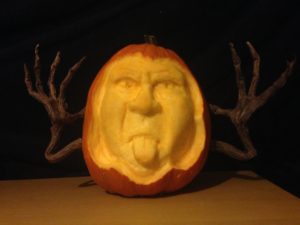 sculpted pumpkin sticking his tongue out