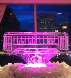 a New Orleans streetcar ice sculpture with pink lighting at the Loews Hotel