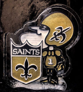 full color black and gold ice sculpture of New Orleans mascot Sir Saint by ice dragon ice sculptures