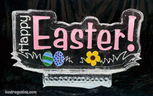 a Happy Easter ice sculpture with color details including eggs and a flower. By ice dragon ice sculptures