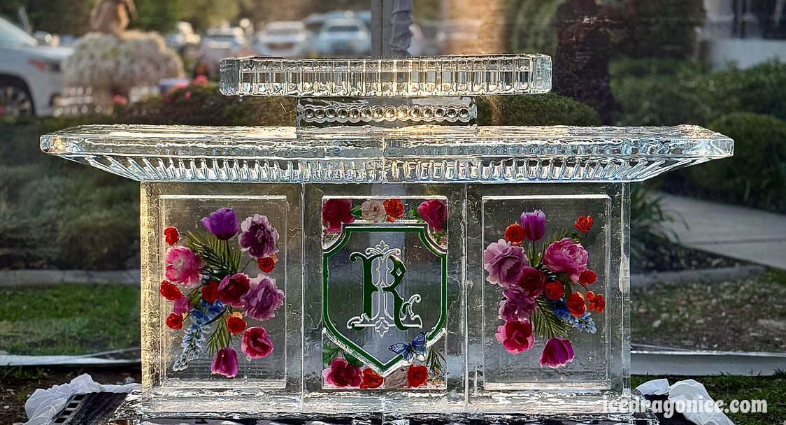 flowered and monogrammed ice bar by ice dragon ice sculptures