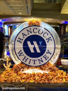 Hancock Whitney Bank logo shrimp luge by ice dragon ice sculptures