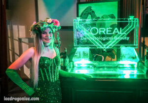 L'Oreal logo ice sculpture with a green fairy at Generations Hall