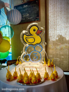 rubber ducky ice luge for a 3rd birthday party by ice dragon ice sculptures. In Mobile, Alabama